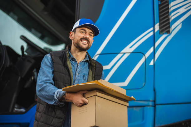 istock Portrait Of Courier With Delivering Package. 2154190171