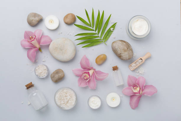 istock Composition with orchids and massage stones on color background, top view 2154191419