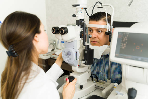 istock Female optometrist conducting a thorough eye exam on a attentive patient with advanced optical diagnostic tools 2154195363