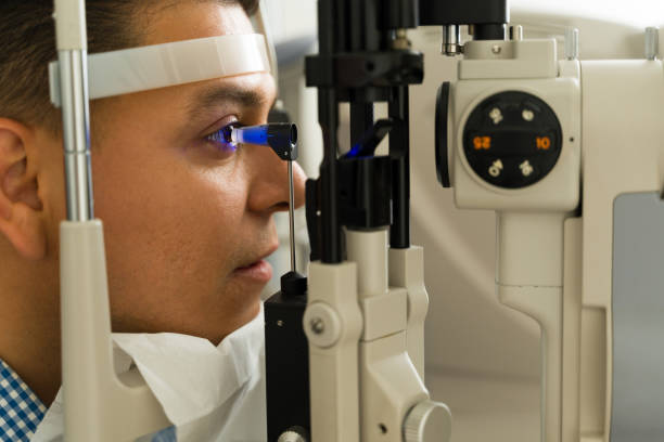 istock Profile view of a patient getting his eye pressure checked by and ophthalmologist using state of the art equipment 2154195422