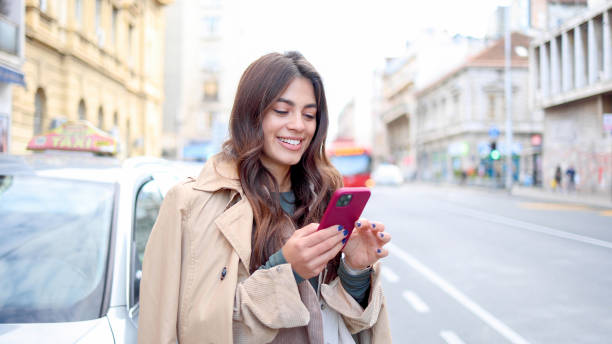 istock Happy Spanish woman walking and texting 2154199898