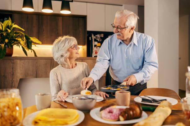 istock A senior couple having breakfast together at home. 2154201691
