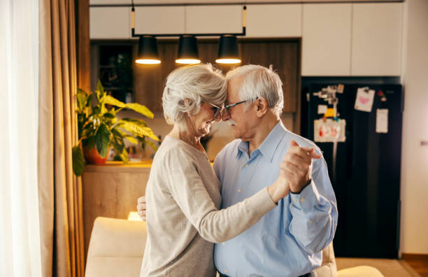 istock A romantic senior couple is dancing at home. 2154201747