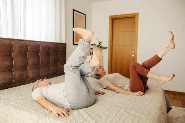 istock A senior couple doing workouts in bedroom in the morning. 2154201807
