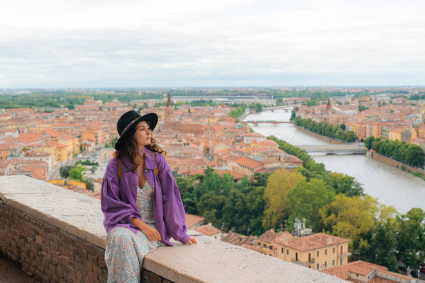 istock Woman looking at Verona from viewpoint 2154203579