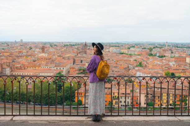istock Woman looking at Verona from viewpoint 2154203580