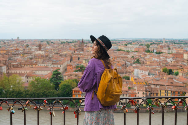 istock Woman looking at Verona from viewpoint 2154203682