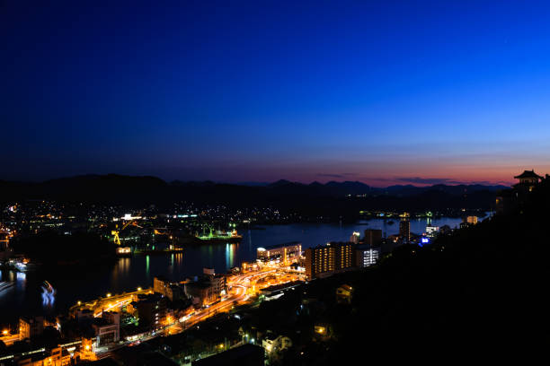 istock Cityscape at Dusk with Illuminated Buildings and Streets 2154203740