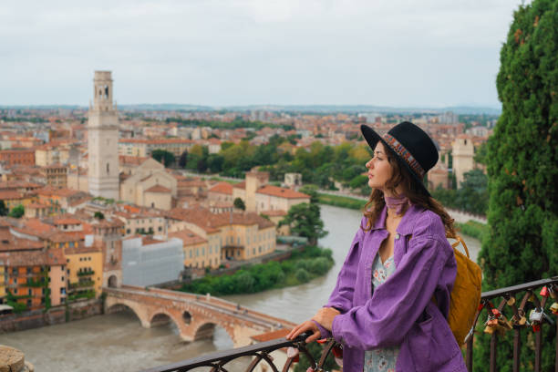 istock Woman looking at Verona from viewpoint 2154204256