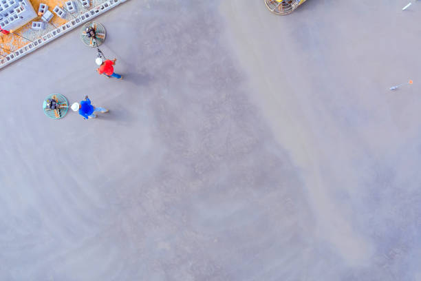 istock After pouring foundation with concrete, it leveled is workers using concrete polishing a machines 2154204908