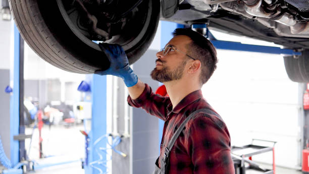 istock Young man fixing cars at his auto service 2154207059