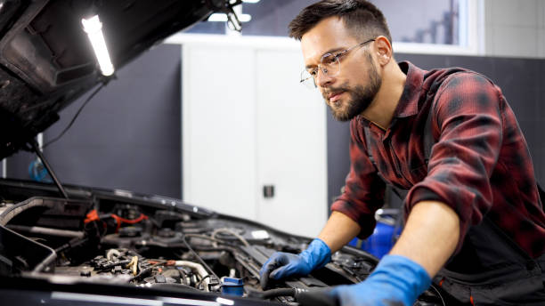 istock Young mechanic checking the work of a car engine 2154207064
