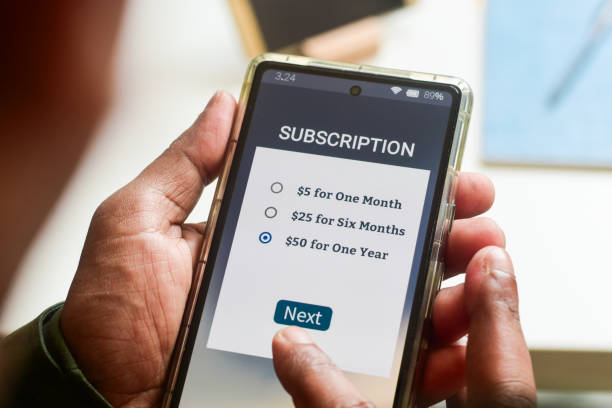 istock Man choosing a annual subscription plan using mobile applications for newspaper or delivery or online streaming service. 2154207370