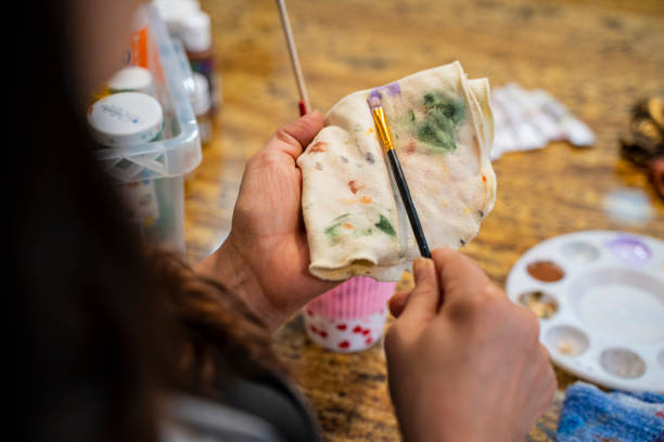 Woman is painting her creations