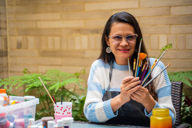 istock Woman is painting in the yard 2154208530