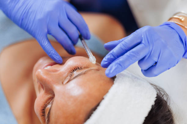 Dermatologist performing a skin injection procedure