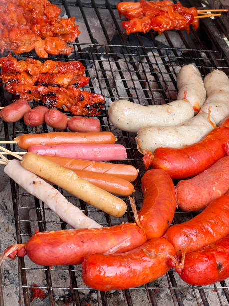 istock sausages on the grill 2154215115