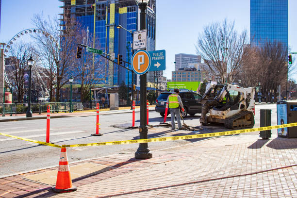 Atlanta, Georgia - Jan 18th 2021: Worker is repairing asphalt on a street in Atlanta, Georgia