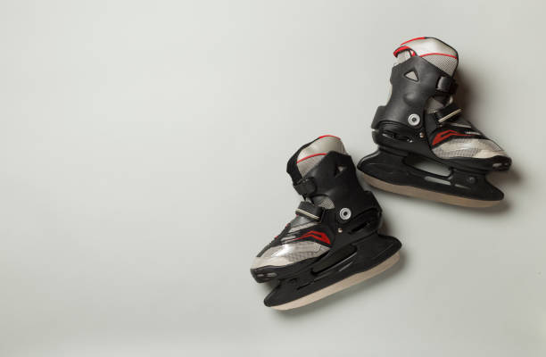 istock Ice skates on color background, top view 2154219844