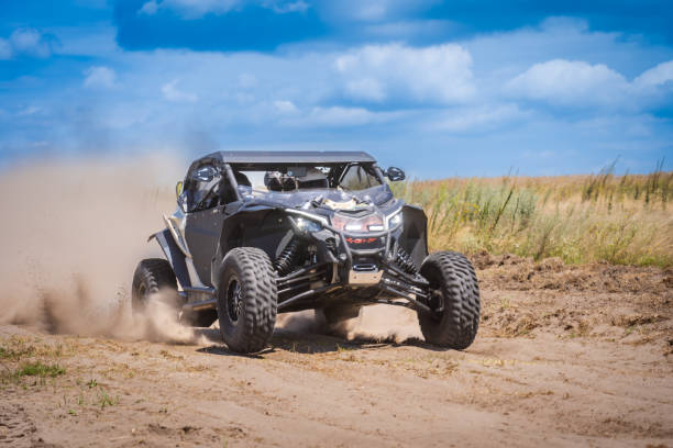 istock UTV in action offroad vehicle racing on sand dune. Extreme, adrenalin. 4x4. 2154219991