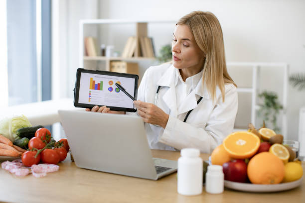 istock Efficient mature specialist in food providing nutritional guideline via graphs. 2154220354