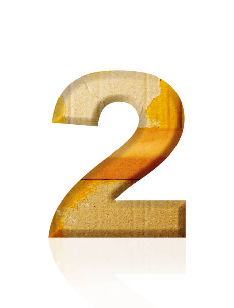 istock Isolated shot of three-dimensional old cardboard number 2 on white background 2154221416