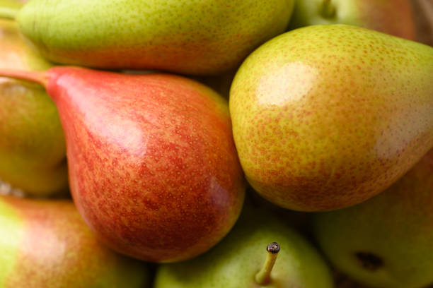 Fresh pear fruit, food background, top view