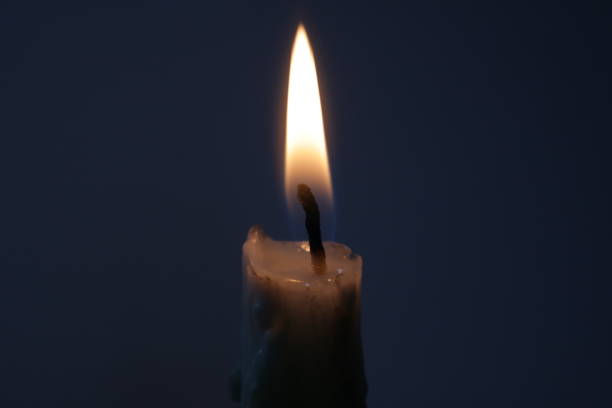 istock Close-up of Flickering Candle Flame 2154222627