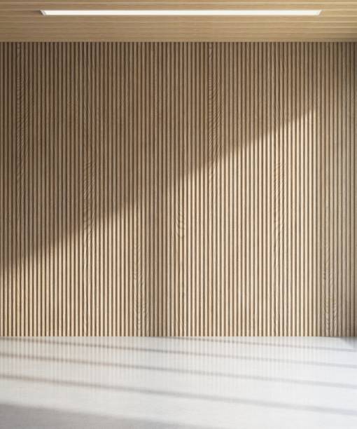 istock Empty room with brown wooden corrugated wall, ceiling in sunlight from window, shadow on white floor 2154233490