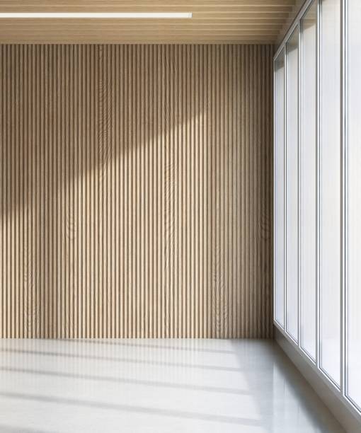 istock Empty room with brown wooden corrugated wall, ceiling in sunlight from window, shadow on white floor 2154233501