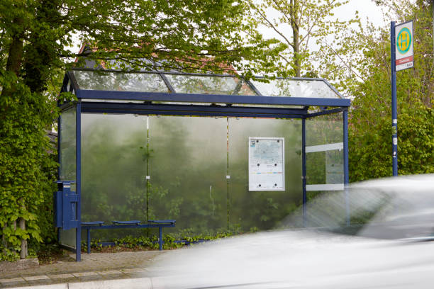 Ense, NRW, Germany, 04 21 2024,  german bus stop, car in motion in front, no people