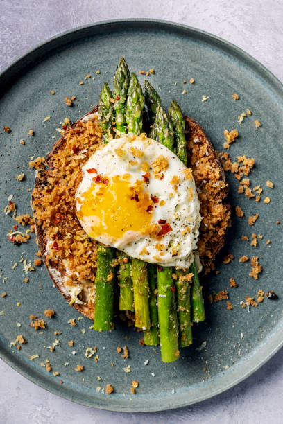 istock Pan Fried Asparagus With Fried Egg and Panko Gremolata 2154236871