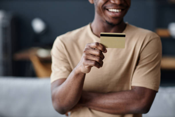 istock Joyful Man Holding Credit Card 2154237353