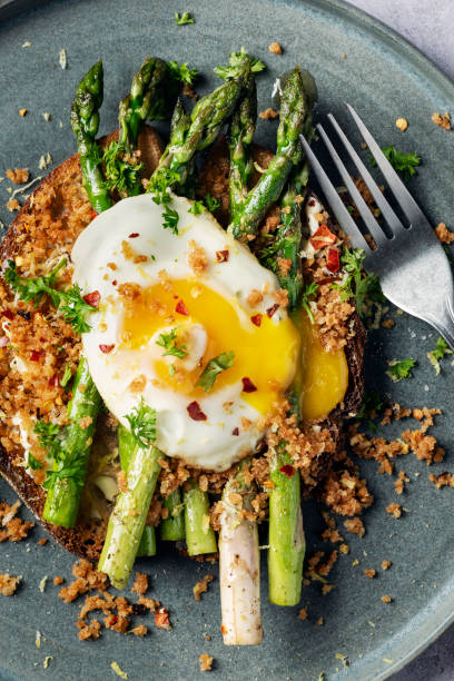 istock Pan Fried Asparagus With Fried Egg and Panko Gremolata 2154237430