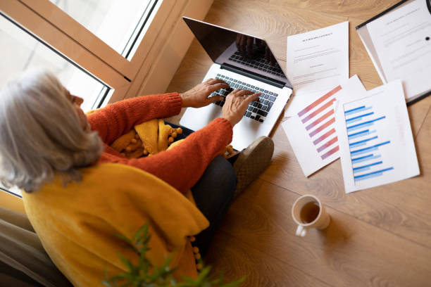 istock Senior Woman Working on Laptop at Home 2154238961