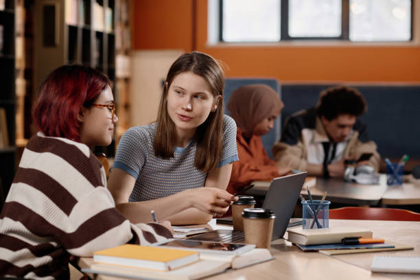 istock Biracial Girls Studying In Library 2154239963
