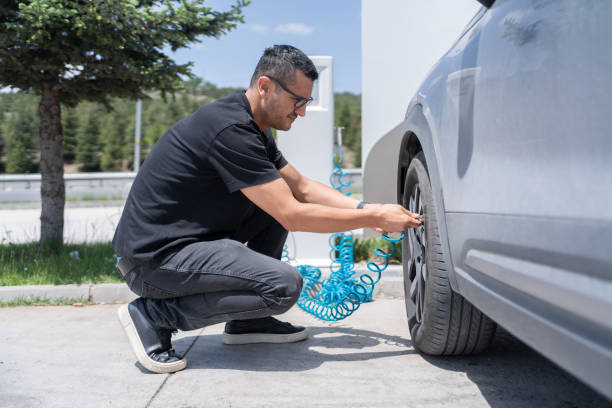 Checking Air Pressure In The Car Wheel