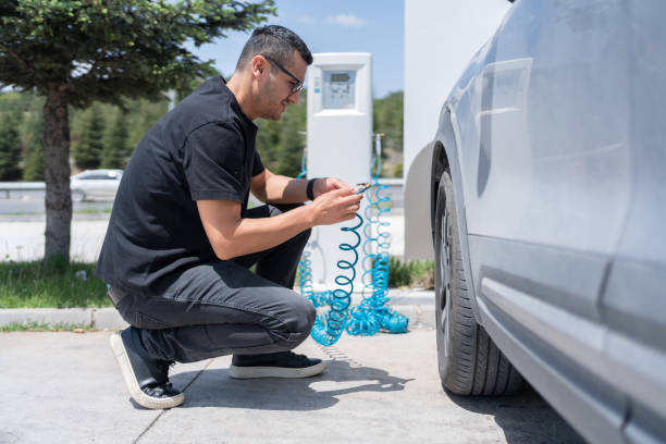 istock Checking Air Pressure In The Car Wheel 2154239970
