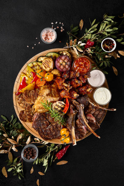 Assorted Grilled Meats and Vegetables Feast on Charcoal BBQ