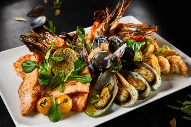 Gourmet Assorted Seafood Platter With Mussels, Salmon, Shrimp, and Octopus on Elegant Tableware
