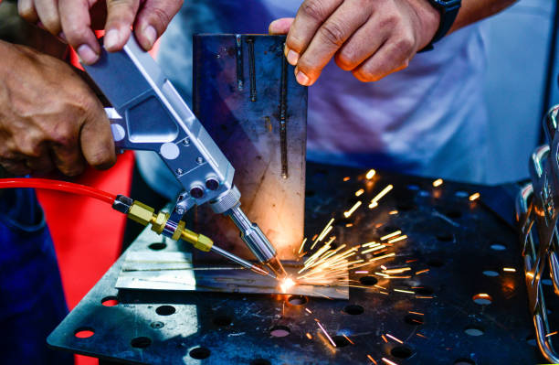 istock Industry worker welding iron pieces work at the factory 2154240707