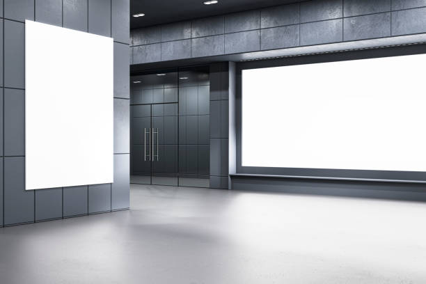 istock Modern corridor with empty billboard spaces, designed in gray and black tones, showcases a futuristic architecture concept. 3D Render 2154242032