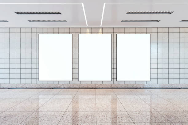 istock Three vertical billboard mockups in a subway station, on a tiled wall with a glossy floor, concept of advertising space. 3D Rendering 2154242281