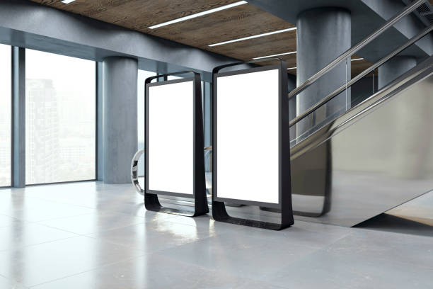istock Two blank advertising billboards inside a modern building, mockup concept on a tiled floor and city view background. 3D Rendering 2154242360
