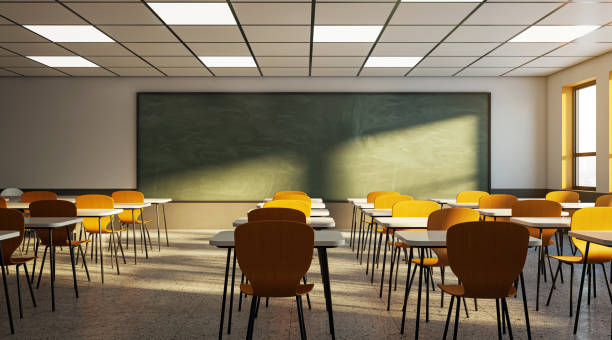 istock Empty classroom with chairs, desks, and a green chalkboard, illuminated by sunlight, evoking education concept. 3D Rendering 2154242374