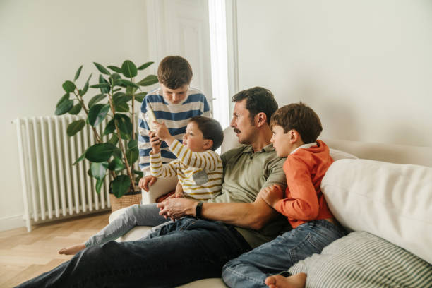 istock Father with his sons at home 2154242494