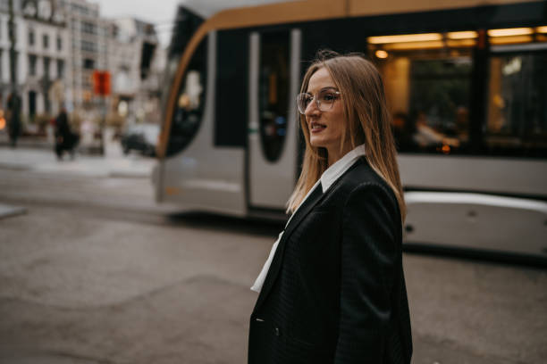istock Businesswoman waiting at bus stop 2154243589