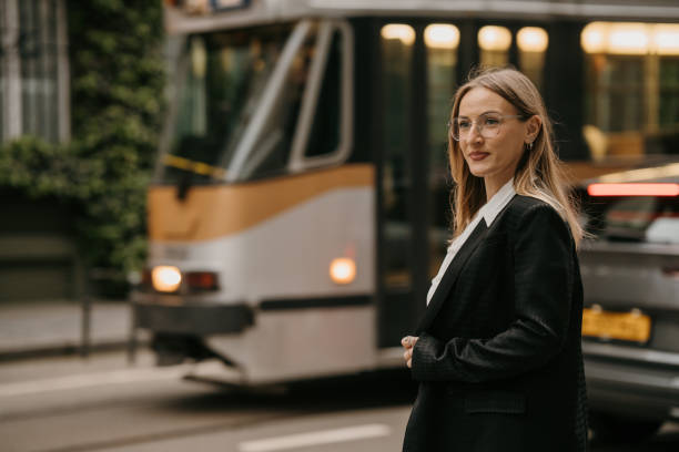 Businesswoman waiting at bus stop