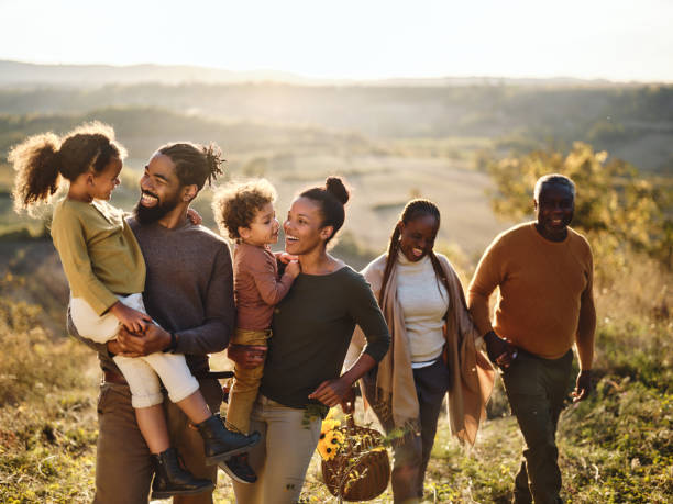 istock Happy black multi-generation family talking while going on a picnic in autumn day. 2154243675