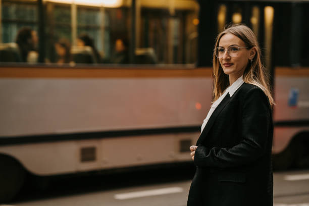 istock Businesswoman waiting at bus stop 2154243798
